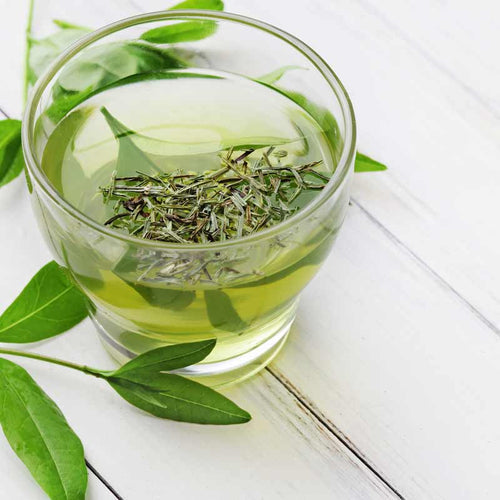 Cup of green tea on marble counter